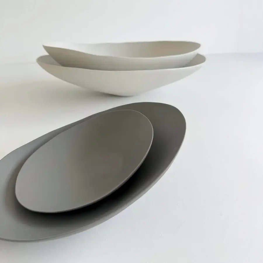 Exceptional Rina Menardi Baccelli centerpiece crafted in muted gray baked clay with gently curved, organic forms and subtle chromatic variations