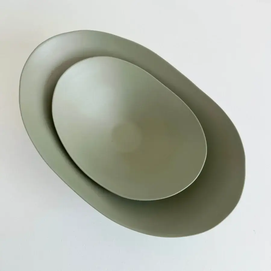 Exclusive Rina Menardi Baccelli centerpiece crafted in earthy green baked clay with a smooth matte finish