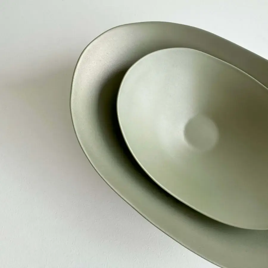 Superior Rina Menardi Baccelli centerpiece crafted in baked clay with organic forms and a muted earthy green matte finish