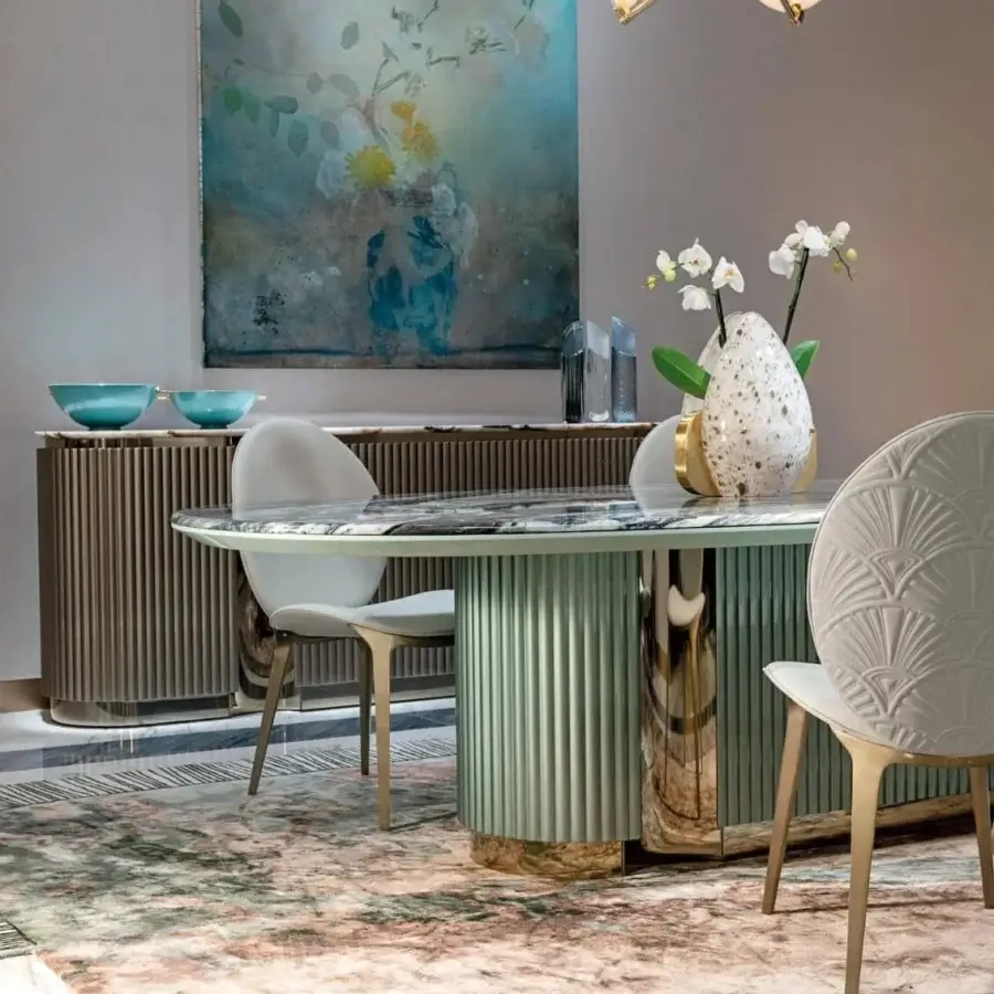 Harmonious Visionnaire Leonardo table with dark marble, intricate Italian metalwork and sage green wooden base crafted in glossy and satin finishes