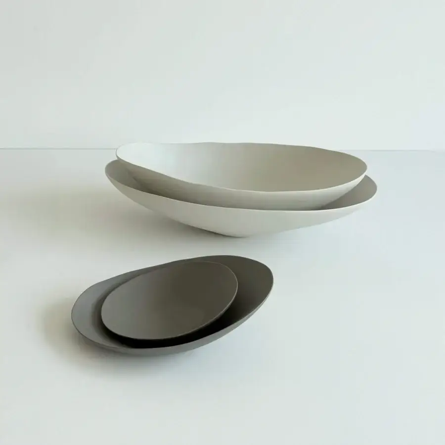 Distinguished Rina Menardi Baccelli centerpiece crafted in baked clay with gently curved shallow bowls and a smooth matte finish