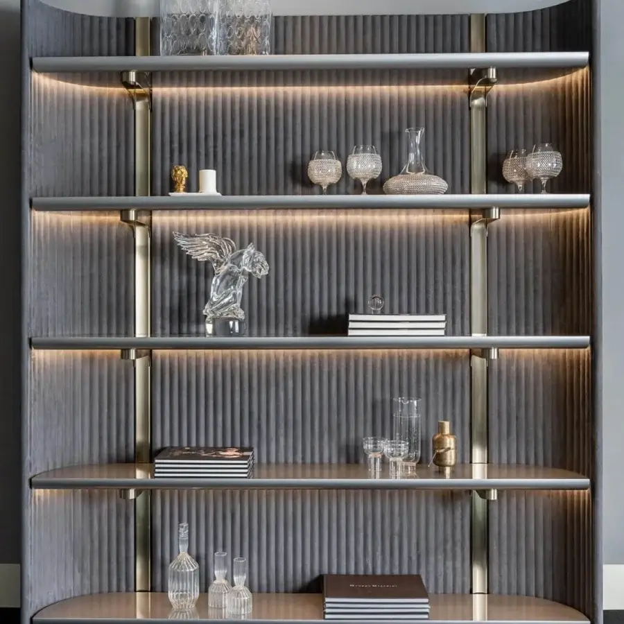 Elegant Visionnaire Leonardo bookcase with shaped matte gray fabric panels and polished golden metal framing with integrated lighting