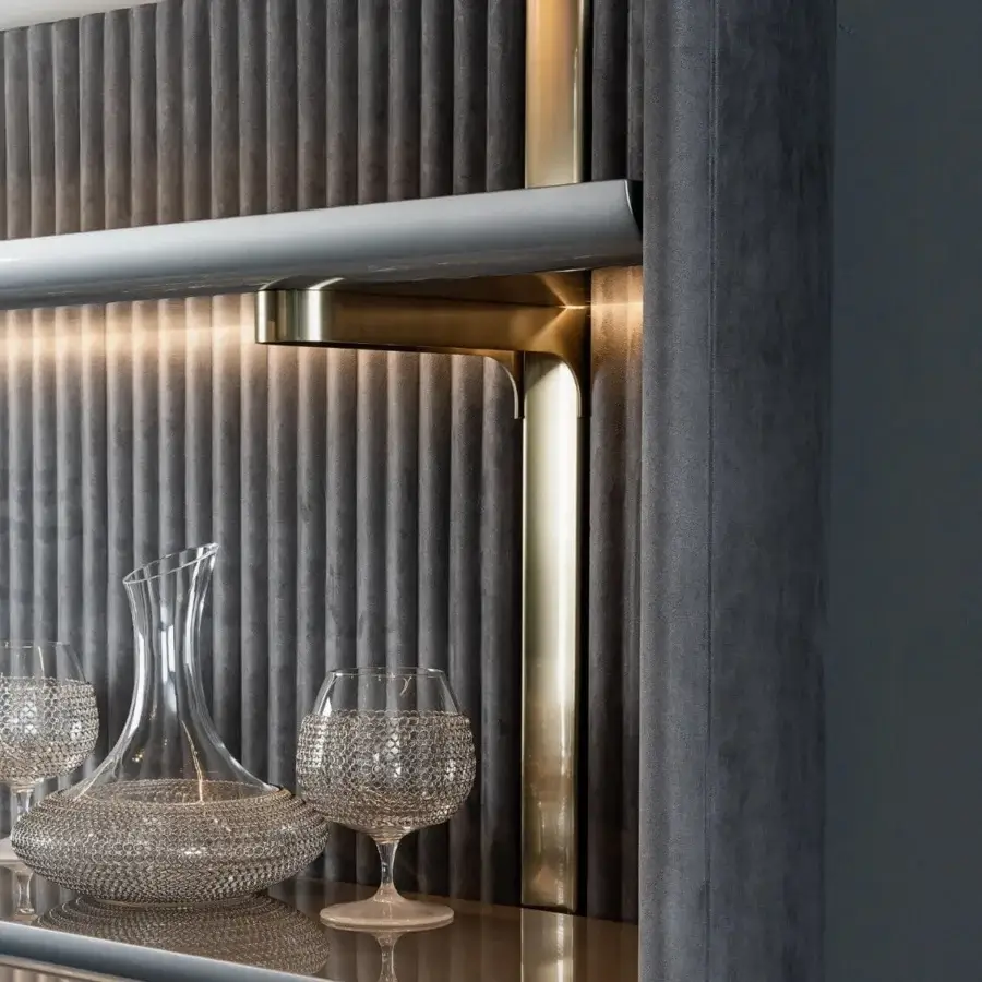 Distinguished Visionnaire Leonardo bookcase with shaped dark gray textile panels and polished golden metal frame