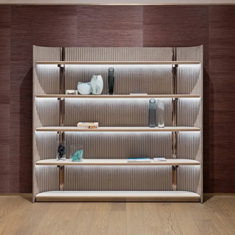 Superior Visionnaire Leonardo bookcase with warm taupe ‘canneté’ stripes, polished metal framing and light-toned wood shelving crafted in shaped MDF