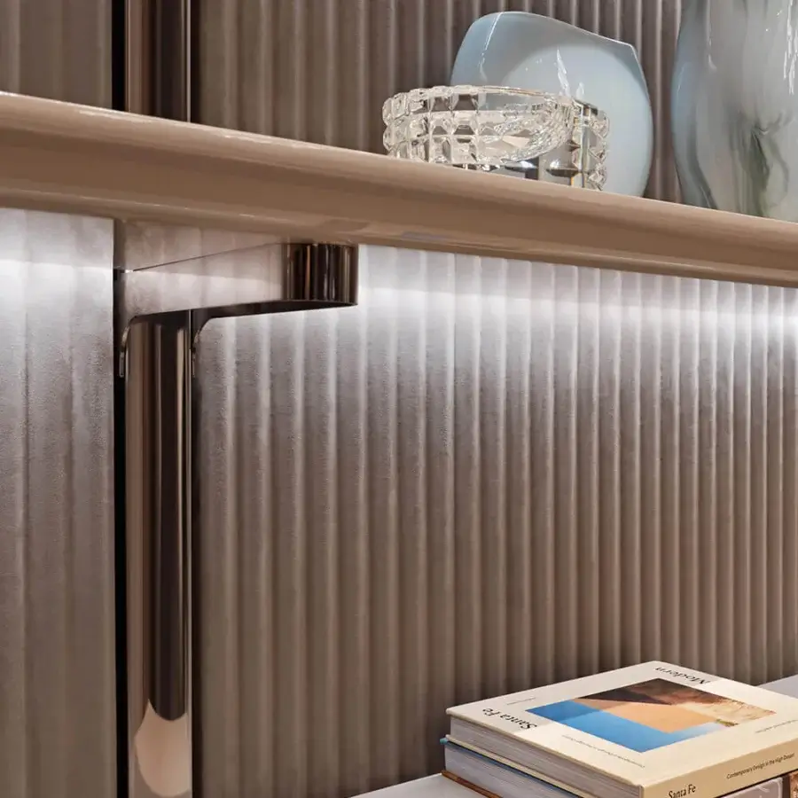 Lavish Visionnaire Leonardo bookcase with textured fabric, ‘canneté’ stripes, and integrated lighting in a warm gray-brown finish