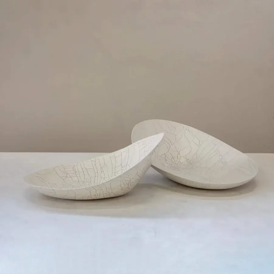 Exclusive Rina Menardi Baccelli Seduti centerpiece sculpted in off-white baked clay with intricate black lines and a matte finish