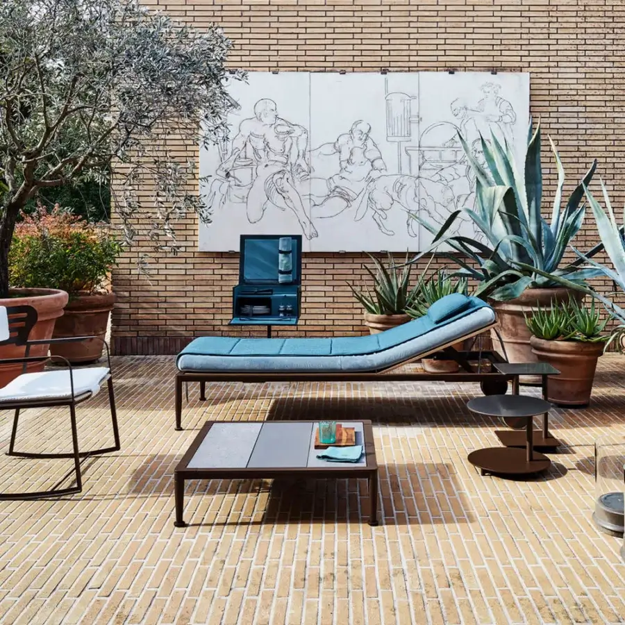 Lavish Giorgetti Gea rocking lounge chair crafted with a geometric carob stainless steel frame and teal birch upholstery