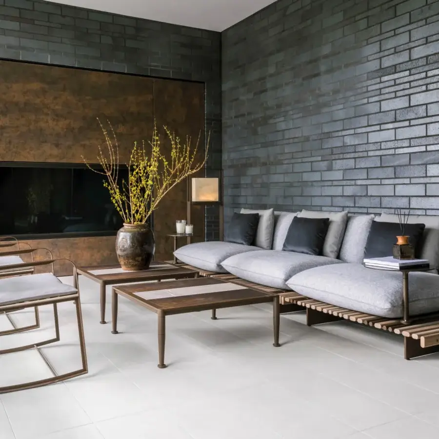 Exceptional Giorgetti Gea rocking lounge chair with geometric carob finished stainless steel and contoured dark gray birch seat