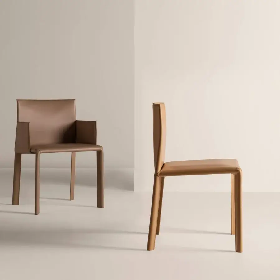 Distinguished Frag Blyn dining chair with full saddle leather upholstery and sleek steel structure in a warm muted brown tone
