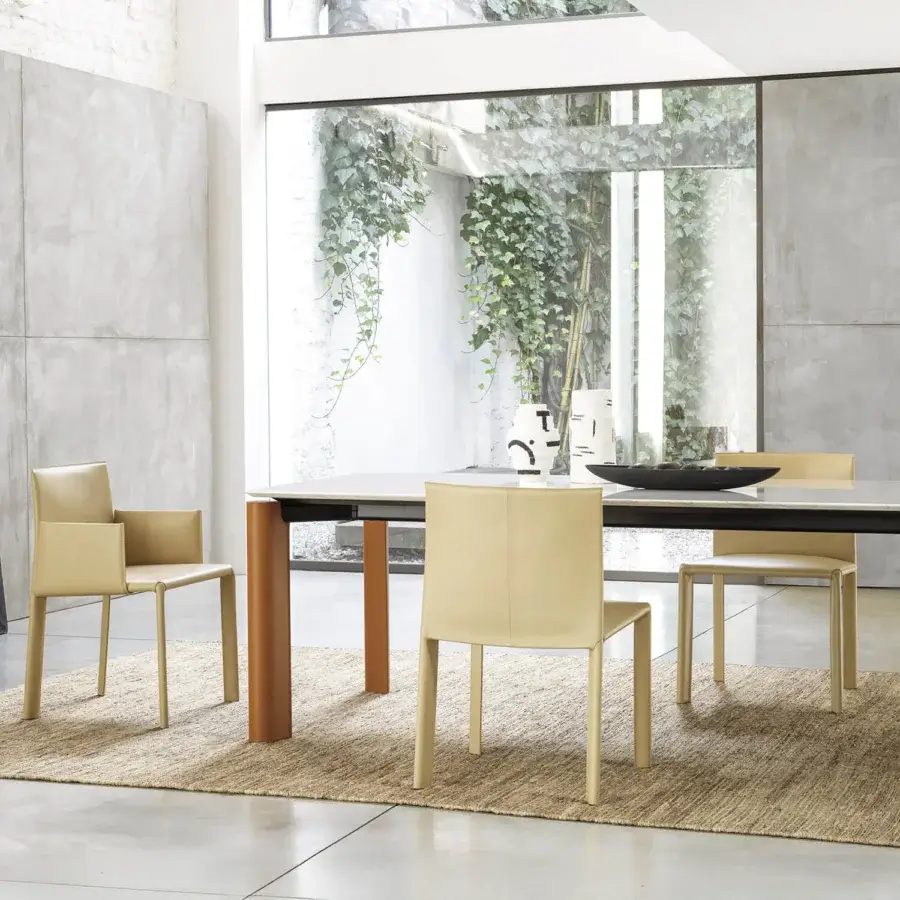 Distinguished Frag Blyn dining chair with full saddle leather upholstery, steel structure and satin finish reddish-brown wood legs