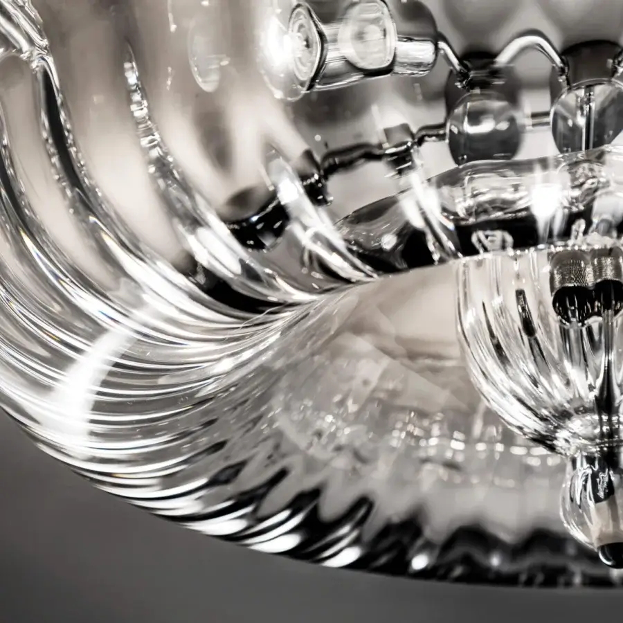 Distinguished Vistosi Novecento table lamp crafted from clear glass with a signature rigadin finish and complex form