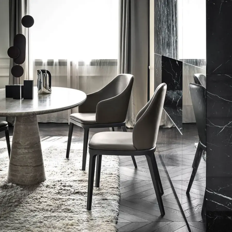Elegant Frag Doa dining chair with padded shell upholstered in muted gray textile and exposed ash wood structure