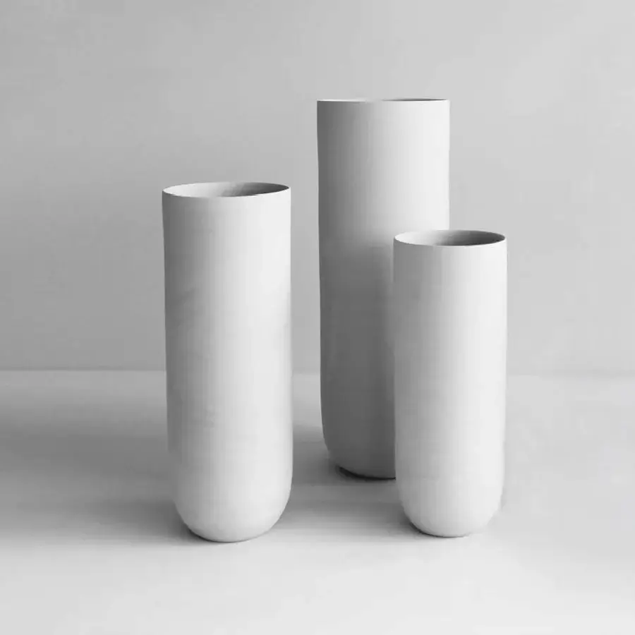 Elegant Rina Menardi Canne vase set crafted from baked clay in off-white and pale beige tones with a smooth matte finish