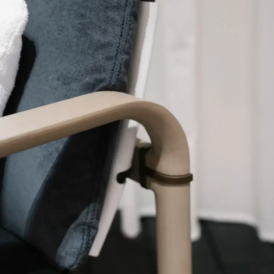 Superior Giorgetti Loop lounge chair with resilient Eva rubber upholstery in muted blue-grey textile and grey water-polished ash wood frame