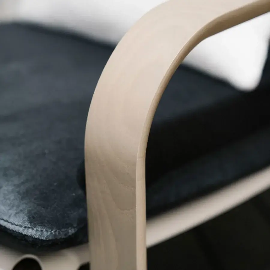 Elegant Giorgetti Loop lounge chair with grey water-polished ash wood, carob aluminum details and dark black Eva rubber seat