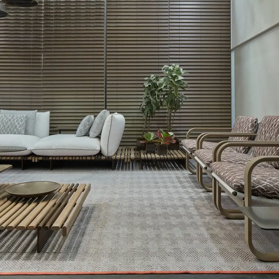 Distinguished Giorgetti Loop lounge chair with grey water-polished ash wood, carob aluminum, and reddish-brown woven fabric cushioning