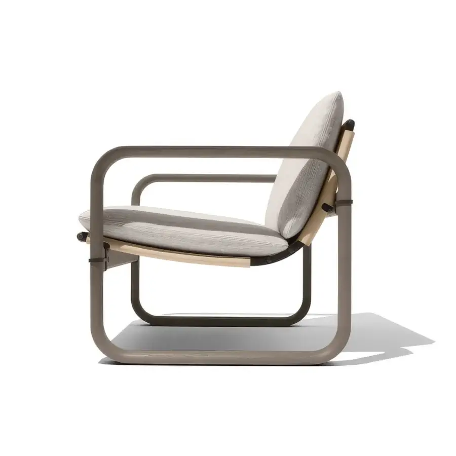 Distinguished Giorgetti Loop lounge chair with grey water-polished ash wood and carob aluminum details, upholstered in light beige Eva rubber textile