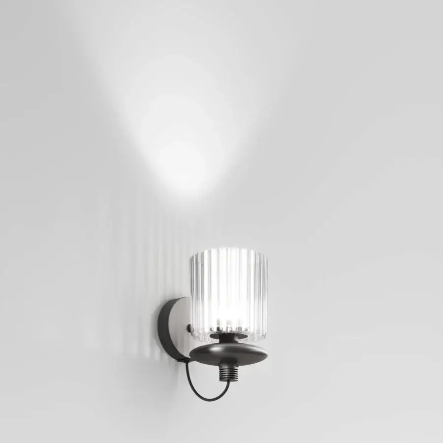Exceptional Vistosi Tread wall lamp handcrafted in dark matte metal with a ribbed glass diffuser for focused illumination