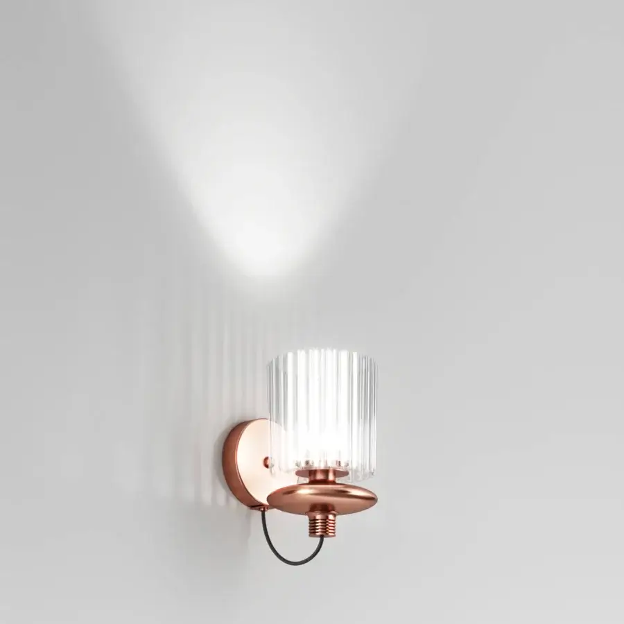 Distinguished Vistosi Tread wall lamp crafted in warm copper-toned metal with a pleated glass diffuser and rhythmic lateral grooves