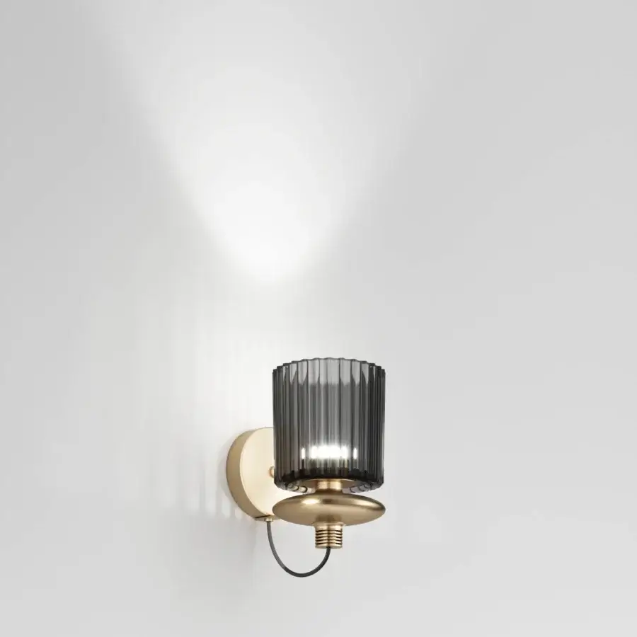 Elegant Vistosi Tread wall lamp crafted in brass-toned metal with a smoky grey pleated glass diffuser and polished finish