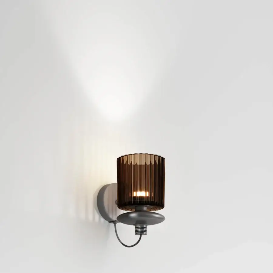 Distinguished Vistosi Tread wall lamp crafted in dark gray matte metal with warm amber vertically ribbed glass diffuser