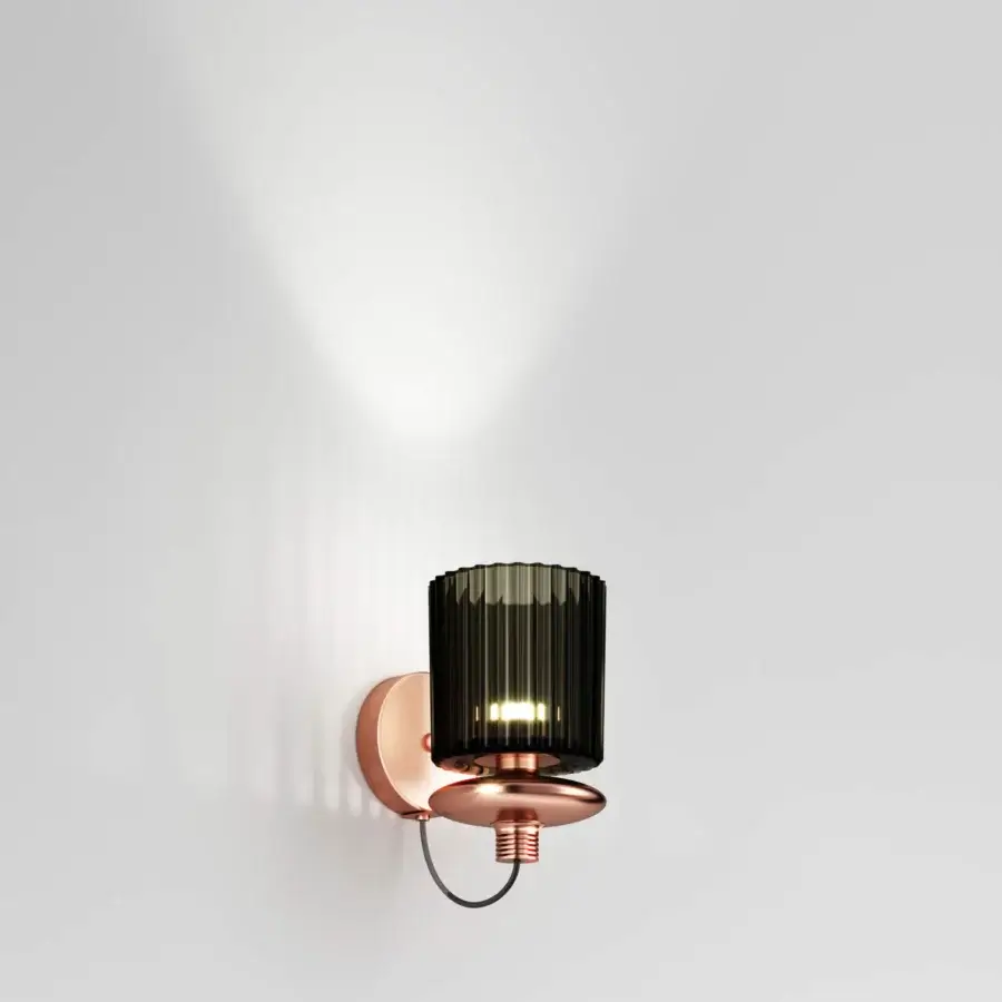 Exceptional Vistosi Tread wall lamp crafted in satin copper-toned metal with a pleated glass diffuser and rhythmic grooves