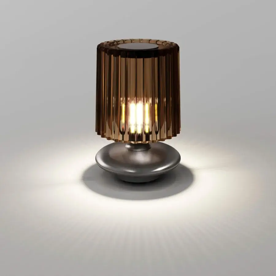 Exceptional Vistosi Tread lamp crafted in warm amber hand-blown Murano glass with a dark gray metal base