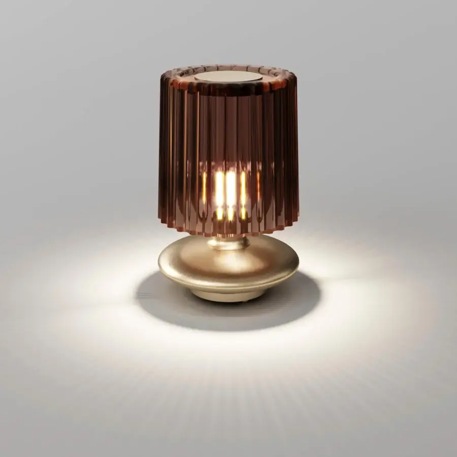 Avant-garde Vistosi Tread lamp crafted in amber Murano glass with a polished golden metal base and ribbed form