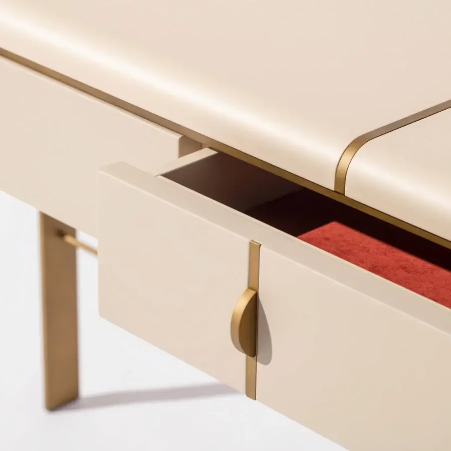 Exceptional Carpanese Home Althea C console built with pale beige synthetic surface and satin brass metal inlays offering refined storage