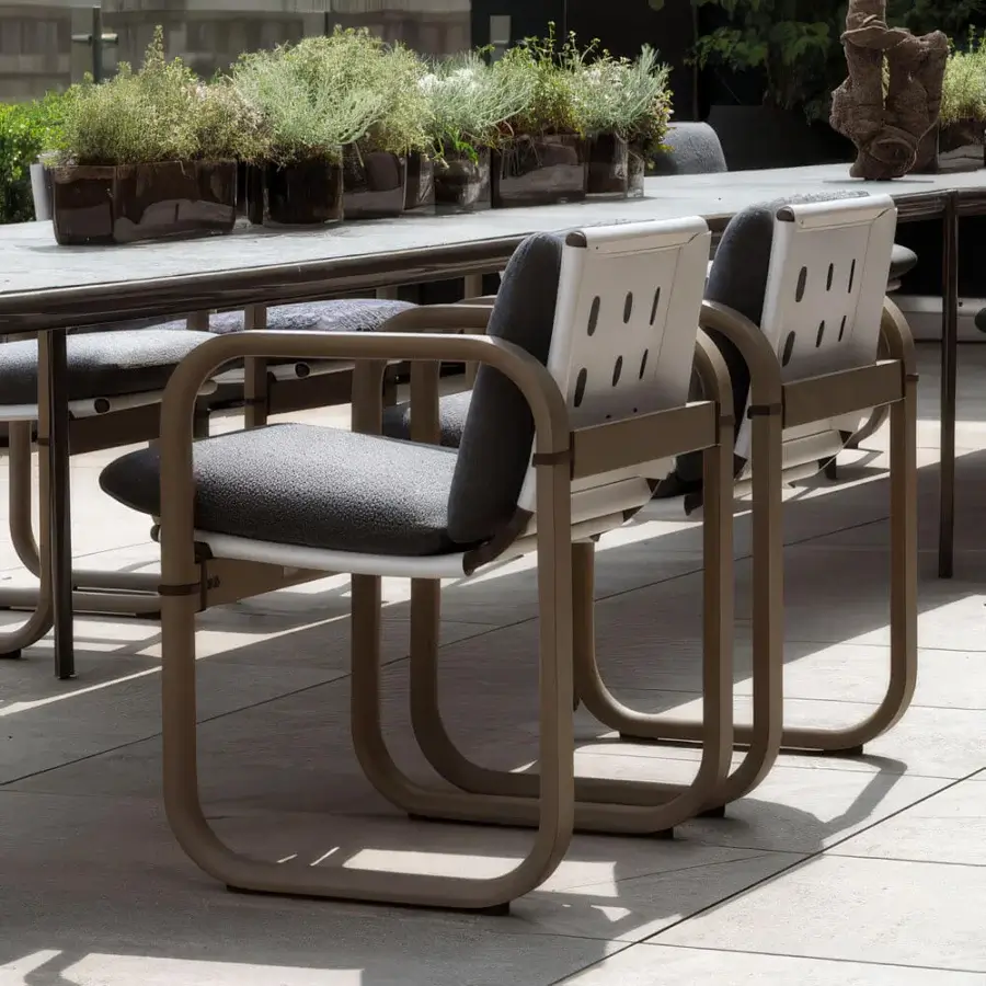 Distinguished Giorgetti Loop armchair with fluid lines and resilient Eva rubber cushions in darker grey waterproof textile crafted with grey water-polished ash wood and carob aluminum