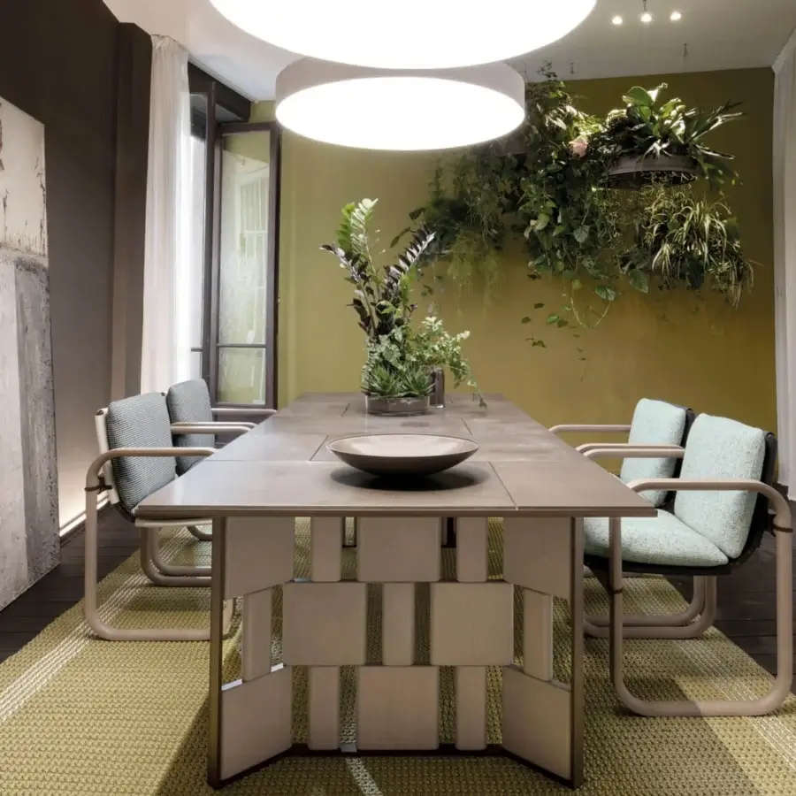 Distinguished Giorgetti Loop armchair with sculpted form, grey water-polished ash wood frame and pale blue-green waterproof upholstery