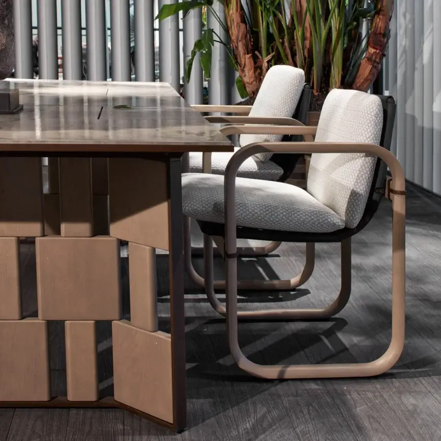 Superior Giorgetti Loop armchair with sculpted form, grey water-polished ash wood and carob aluminum details upholstered in light grey Eva rubber