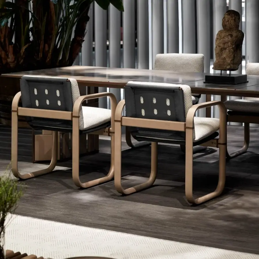 Distinguished Giorgetti Loop armchair with sculpted lines, grey water-polished ash wood and carob-toned aluminum detailing