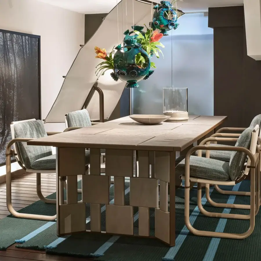 Captivating Giorgetti Loop armchair with fluid sculpted lines, teal waterproof textile and grey water-polished ash wood frame