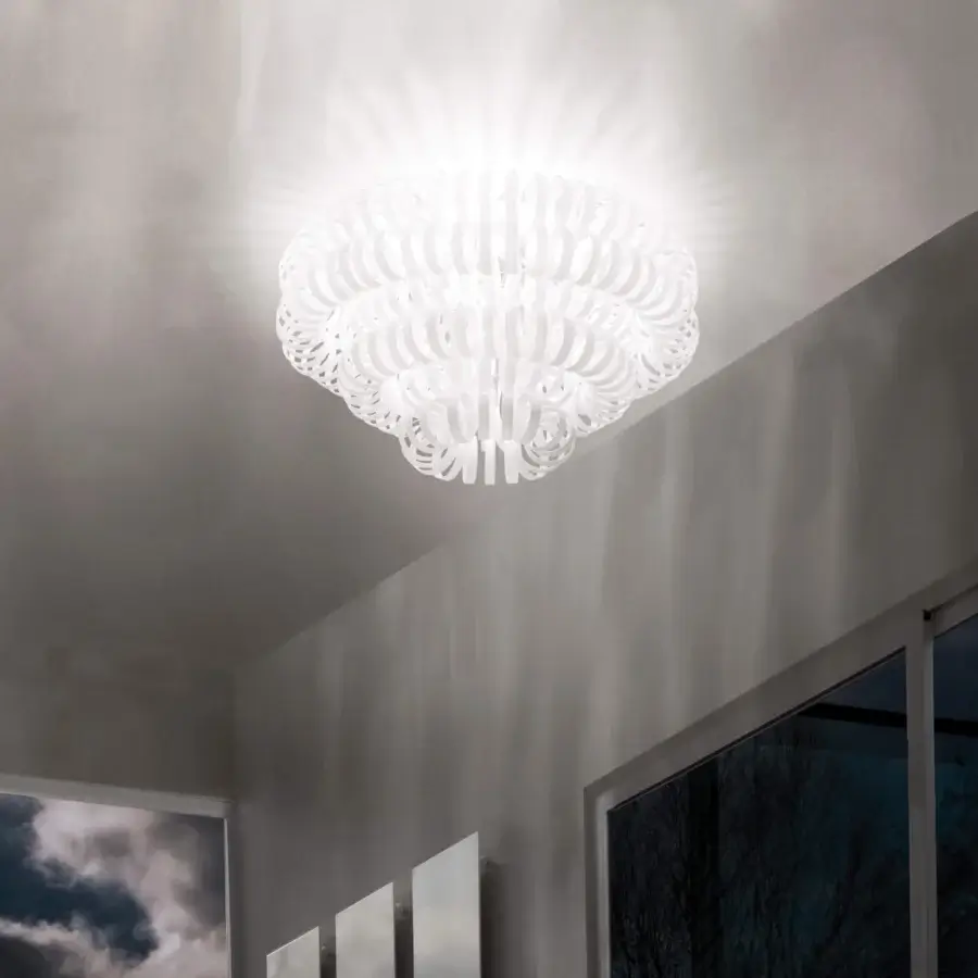 Distinguished Vistosi Ecos ceiling lamp crafted in white hand-blown Murano glass with a signature rigadin texture radiating petal-like elements
