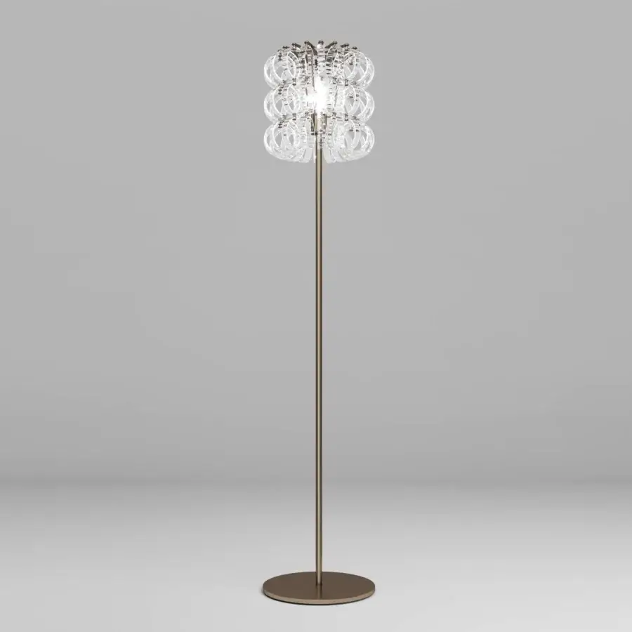 Exceptional Vistosi Ecos floor lamp crafted in brushed bronze metal with hand-blown Murano glass rings exhibiting rigadin texture
