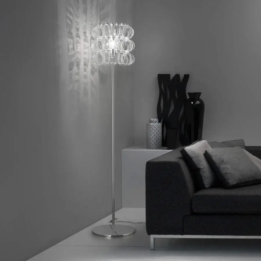 Superior Vistosi Ecos floor lamp built with hand-blown Murano glass and polished metal in a tiered crystalline silhouette
