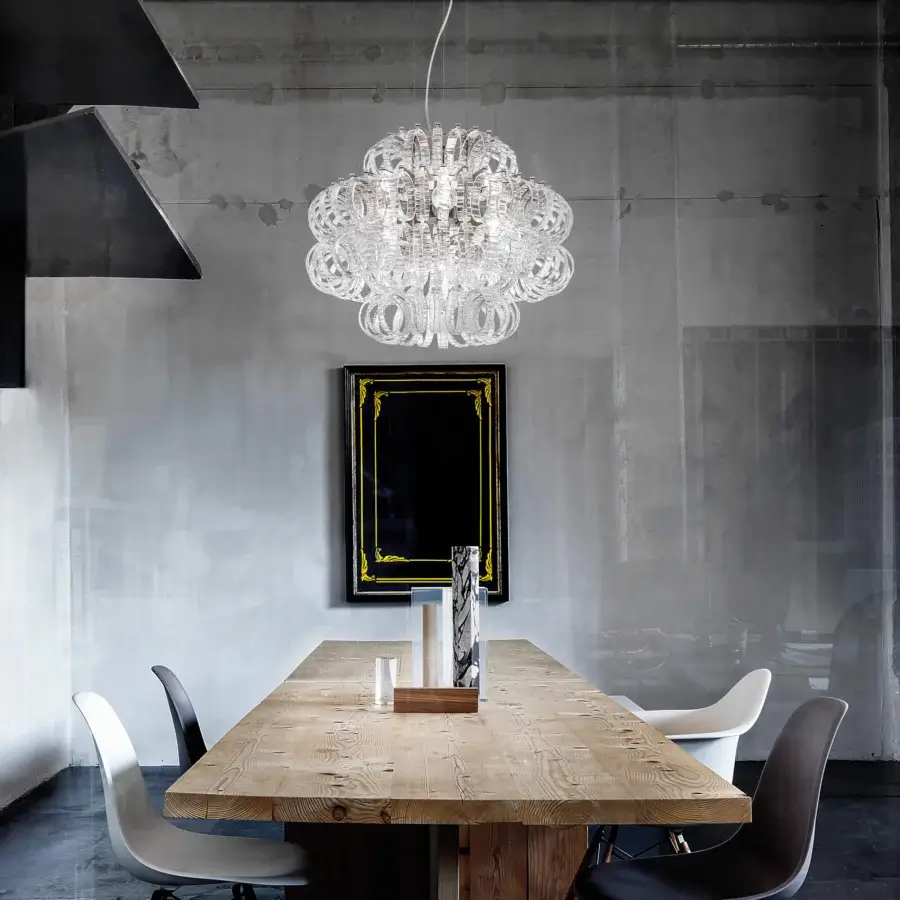 Exceptional Vistosi Ecos suspension lamp crafted in clear hand-blown Murano glass with signature rigadin texture and contemporary form