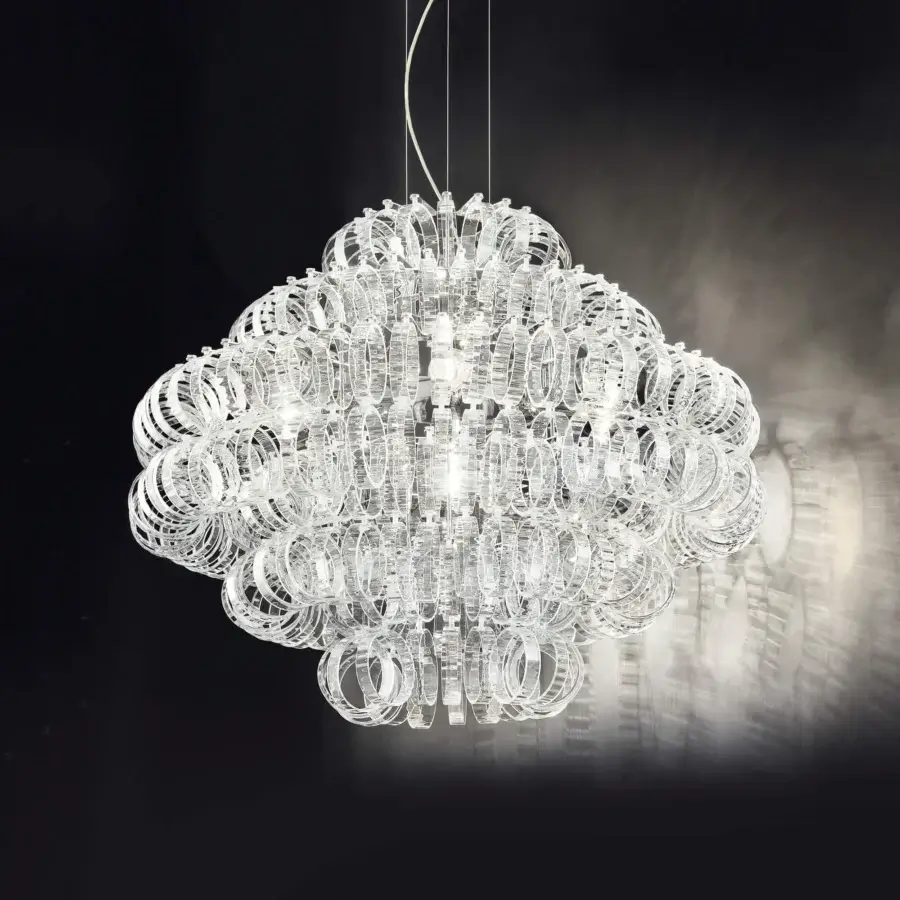 Elegant Vistosi Ecos suspension lamp crafted in clear hand-blown Murano glass with a rigadin texture creating a brilliant shimmer