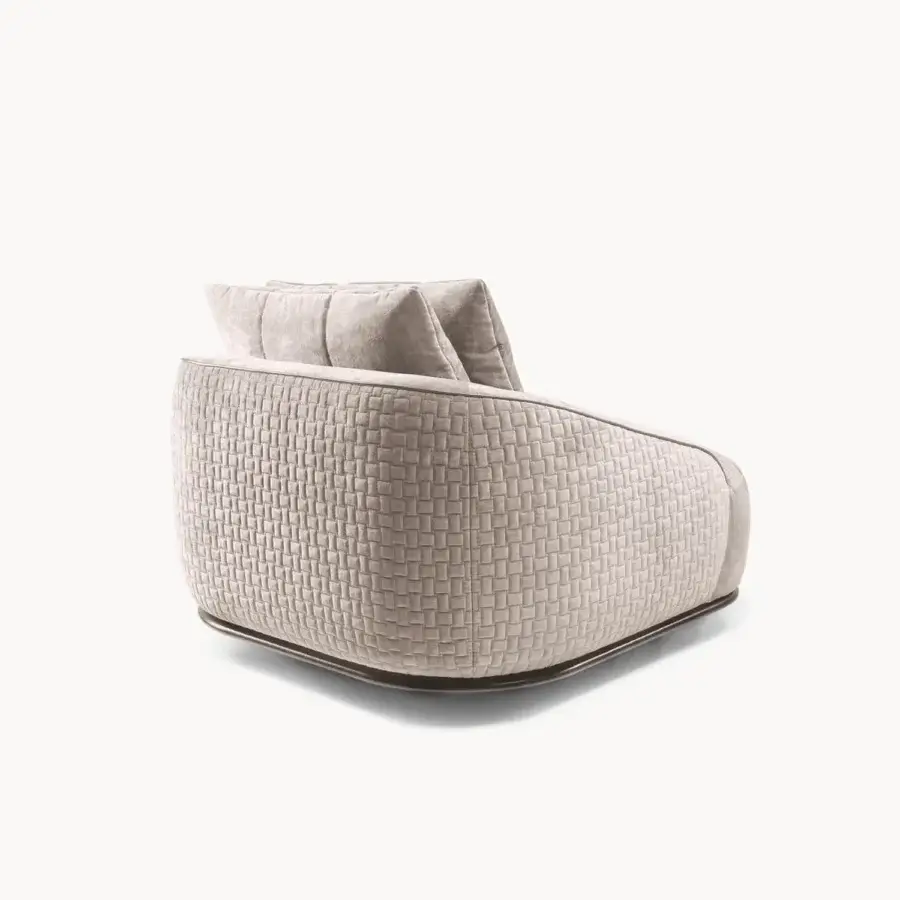 Sophisticated Visionnaire Holden lounge chair with quilted beige textile upholstery and dark circular base