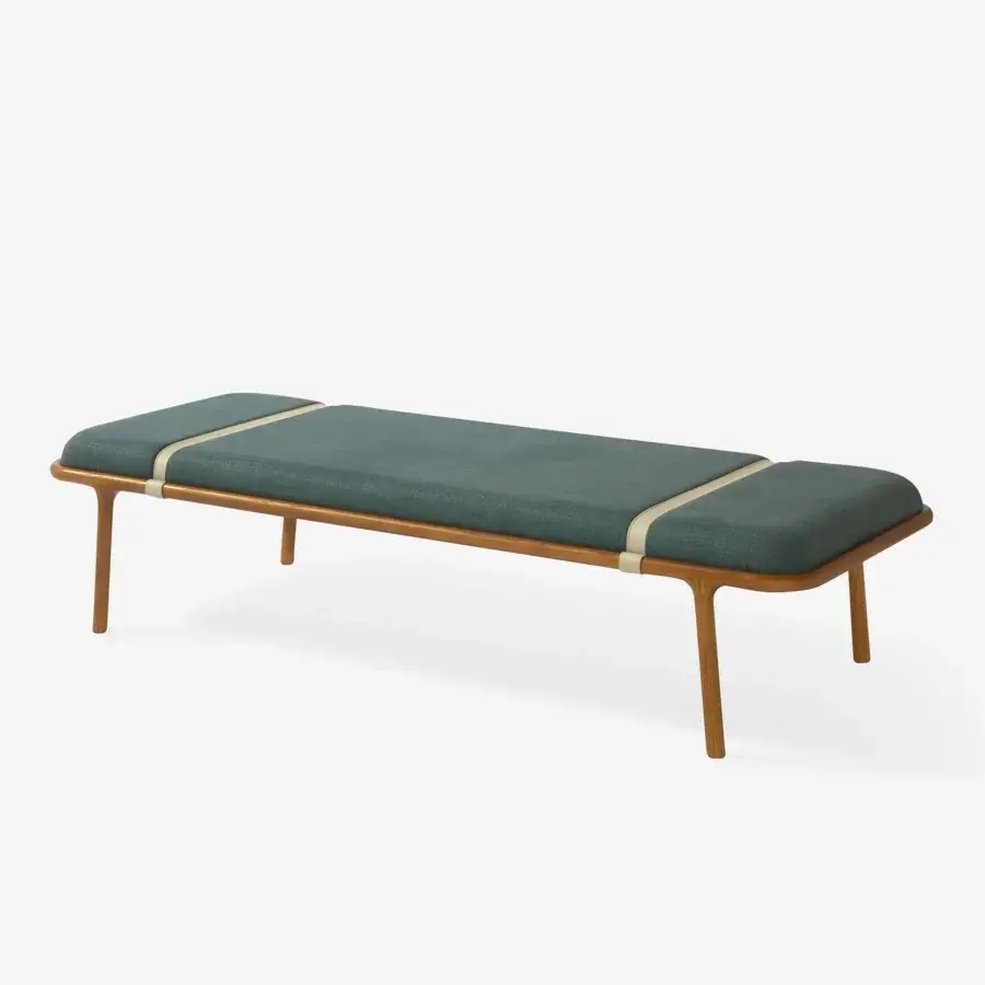 Sophisticated Carpanese Home Belts bench with a medium wood frame and dark teal textile cushioning accented by woven cream belts
