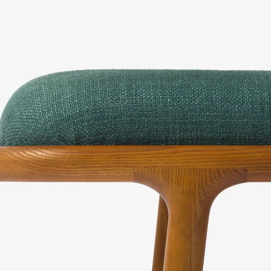 Lavish Carpanese Home Belts bench built with reddish-brown wood and a plush deep teal textured seat cushion