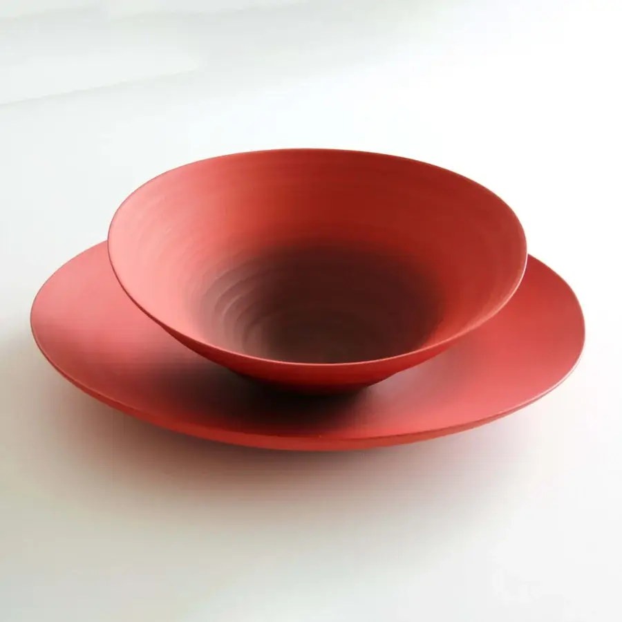 Distinguished Rina Menardi Campanelle centerpiece crafted in Italy with coral red baked clay and smooth matte surfaces