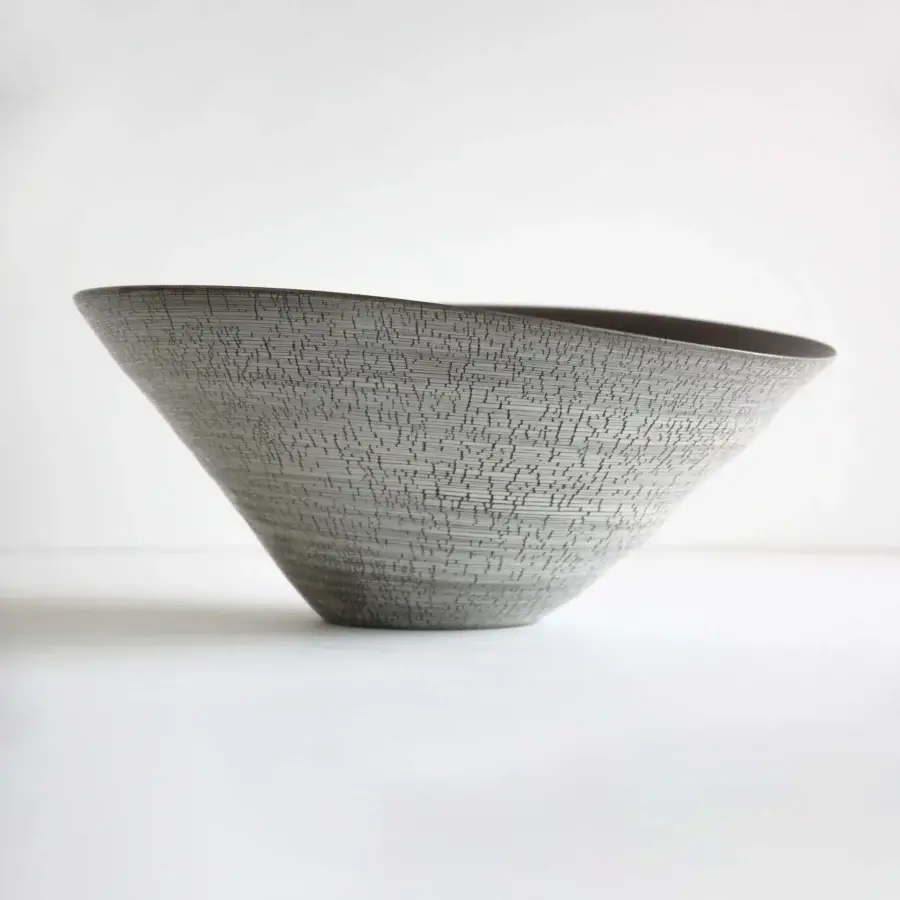 Distinguished Rina Menardi Campanelle centerpiece crafted in Italy from baked clay with a muted gray finish