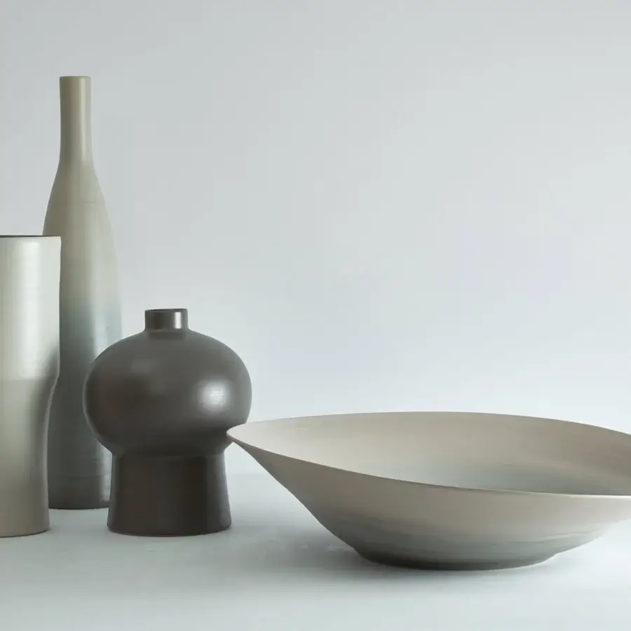 Exceptional Rina Menardi Campanelle plate centerpiece crafted from baked clay in a muted light grey with matte finish