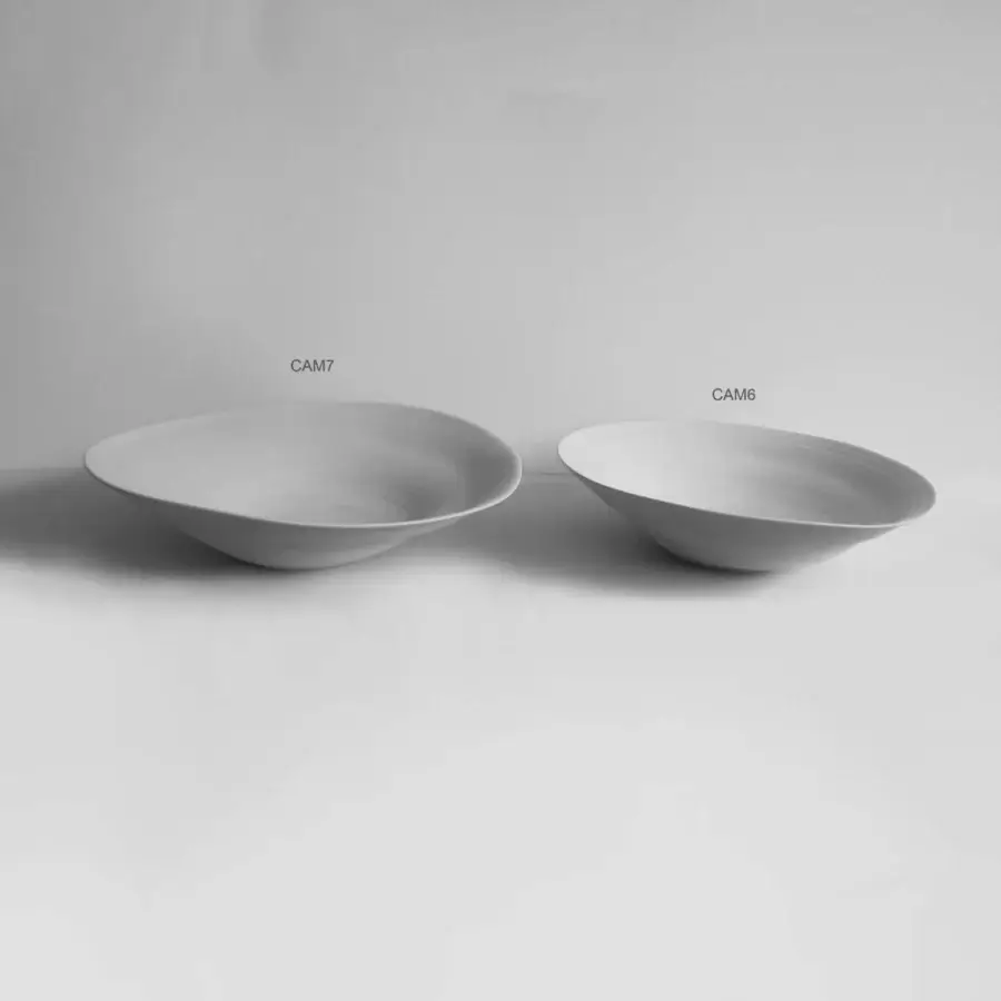 Exclusive Rina Menardi Campanelle plate centerpiece crafted in light gray baked clay with a smooth matte finish