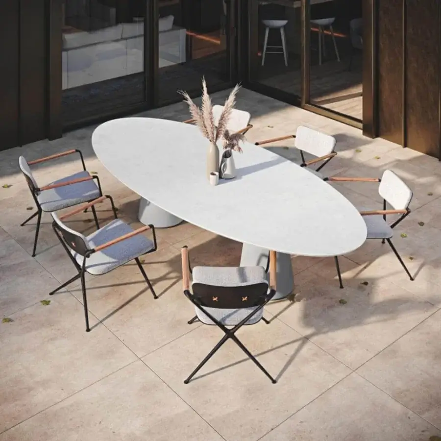 Distinguished Royal Botania Conix table with smooth white concrete top and conical Ductal® concrete bases