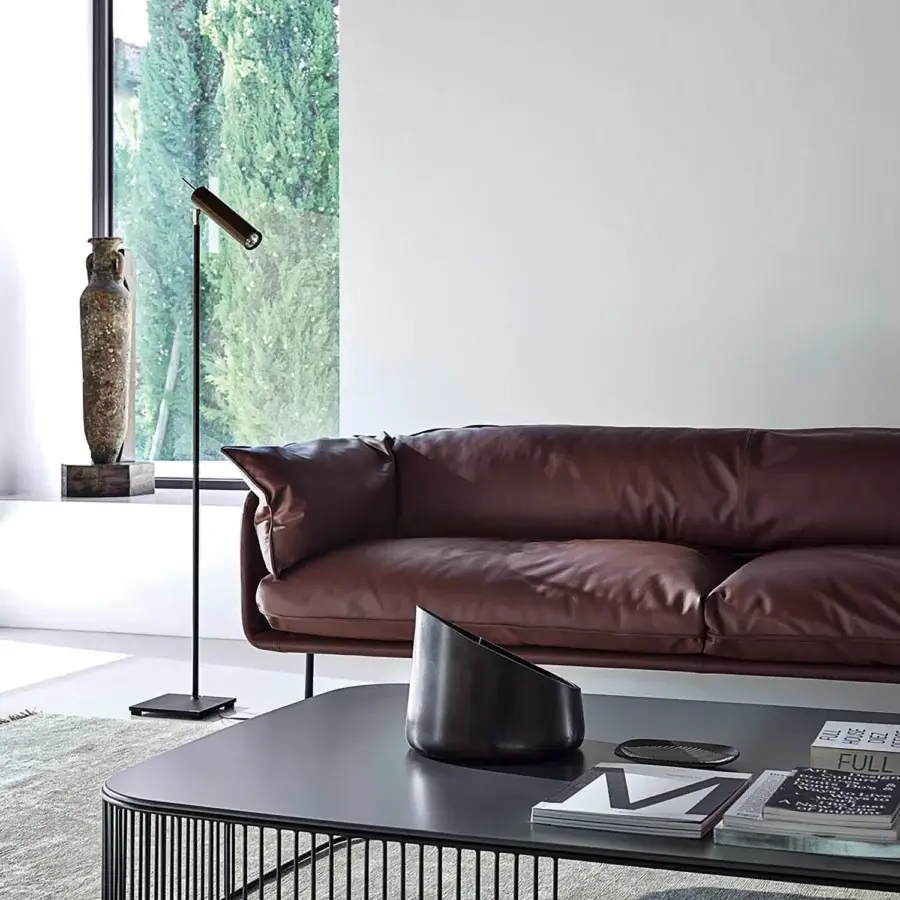 Elegant Frag Winnie sofa upholstered in reddish-brown premium leather with a smooth, slightly textured finish