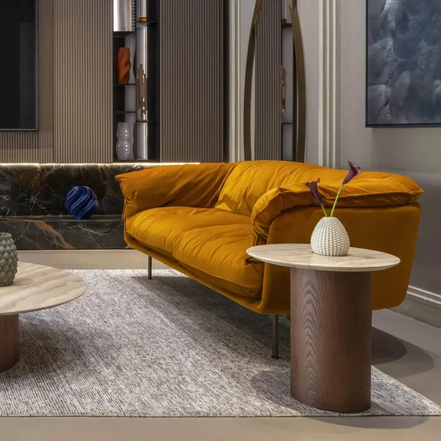 Distinguished Frag Winnie sofa upholstered in plush golden-yellow fabric with soft padding and rounded lines