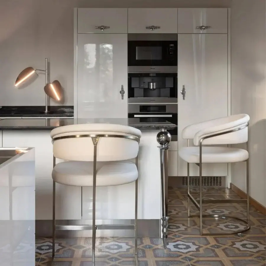 Exceptional Visionnaire Clem stool with creamy white upholstery and a polished brass engraved frame